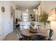 Open concept kitchen and dining area with farmhouse style at 1104 Hitchfield Ln, Awendaw, SC 29429