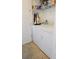 Laundry room with washer, dryer, and storage shelves at 1104 Hitchfield Ln, Awendaw, SC 29429