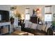 Spacious living room with leather sofa and hardwood floors at 1104 Hitchfield Ln, Awendaw, SC 29429