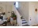 Elegant staircase with white railings and dark wood treads at 1104 Hitchfield Ln, Awendaw, SC 29429