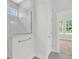 Modern bathroom with a glass enclosed shower and gray tile at 1149 Reserve Ln, Awendaw, SC 29429