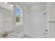 A modern bathroom boasts white subway tile, a single sink vanity and natural light from a window at 1149 Reserve Ln, Awendaw, SC 29429