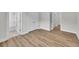 A bedroom boasts hard wood floors, natural light and access to the Primary bathroom at 1149 Reserve Ln, Awendaw, SC 29429