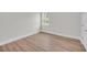 Unfurnished bedroom with wood floors and a window to the outdoors at 1149 Reserve Ln, Awendaw, SC 29429