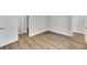 Bedroom featuring wood floors and a doorway to the bathroom at 1149 Reserve Ln, Awendaw, SC 29429