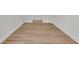 Hallway with wooden floors, white walls, and doorways at 1149 Reserve Ln, Awendaw, SC 29429