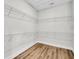 Walk-in closet featuring wood floors and wire shelving at 1149 Reserve Ln, Awendaw, SC 29429