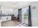 Bright eat-in kitchen, featuring white cabinets and a sliding glass door to backyard at 1216 Dyson Dr, Moncks Corner, SC 29461