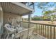Relaxing deck with wicker furniture and marsh views at 1240 Creek Watch Trce, Seabrook Island, SC 29455