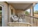 Spacious deck with wicker furniture and tranquil setting at 1240 Creek Watch Trce, Seabrook Island, SC 29455