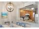 Dining area with a coastal-themed table setting and chandelier at 1240 Creek Watch Trce, Seabrook Island, SC 29455