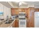Well-equipped kitchen with granite countertops and wood cabinets at 1240 Creek Watch Trce, Seabrook Island, SC 29455