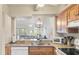 Kitchen boasts granite countertops and wood cabinets at 1240 Creek Watch Trce, Seabrook Island, SC 29455