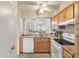 Kitchen with granite countertops, wood cabinets, and modern appliances at 1240 Creek Watch Trce, Seabrook Island, SC 29455