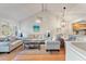 Spacious living room with vaulted ceiling, hardwood floors, and comfy seating at 1240 Creek Watch Trce, Seabrook Island, SC 29455