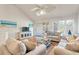 Light-filled living room with hardwood floors, vaulted ceilings, and comfortable seating at 1240 Creek Watch Trce, Seabrook Island, SC 29455