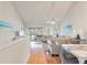 Bright living room with vaulted ceiling, hardwood floors, and access to a screened porch at 1240 Creek Watch Trce, Seabrook Island, SC 29455