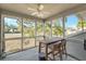 Screened porch with table and chairs, offering marsh views at 1240 Creek Watch Trce, Seabrook Island, SC 29455
