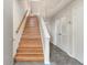 Interior view of wooden staircase with tile flooring at 1240 Creek Watch Trce, Seabrook Island, SC 29455