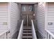 Exterior view of wooden staircase leading to two townhome entrances at 1240 Creek Watch Trce, Seabrook Island, SC 29455