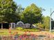 The Hamlets community entrance, featuring a landscaped area with rose bushes at 127 Spalding Cir, Goose Creek, SC 29445