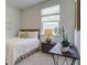 Bright bedroom with a queen-size bed and wood nightstand at 135 River Hill Rd, Goose Creek, SC 29445