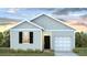 One-story house with gray siding, black shutters, and a white garage door at 135 River Hill Rd, Goose Creek, SC 29445