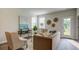 Living room with a brown sofa, two armchairs, and access to a backyard at 135 River Hill Rd, Goose Creek, SC 29445