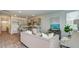 Open concept kitchen with gray cabinets and breakfast bar at 147 River Hill Rd, Goose Creek, SC 29445