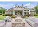 Outdoor oasis with fire pit and seating area, perfect for entertaining at 1484 Old Rosebud Trl, Awendaw, SC 29429
