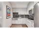 Small galley kitchen featuring a farmhouse sink and dark tile backsplash at 1484 Old Rosebud Trl, Awendaw, SC 29429