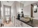 Elegant bathroom with modern vanity, concrete sink, and mosaic tile floor at 1484 Old Rosebud Trl, Awendaw, SC 29429