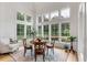 Charming breakfast nook with a round table and plenty of natural light at 1484 Old Rosebud Trl, Awendaw, SC 29429