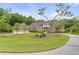 Stunning two-story home with brick facade and circular driveway at 1484 Old Rosebud Trl, Awendaw, SC 29429