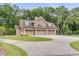 Spacious four-car garage with brick and stone exterior at 1484 Old Rosebud Trl, Awendaw, SC 29429