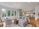 Relaxing living area with comfortable seating and a view of the backyard at 1484 Old Rosebud Trl, Awendaw, SC 29429