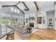 Open living space with high ceilings, exposed beams, and hardwood floors at 1484 Old Rosebud Trl, Awendaw, SC 29429