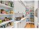 Well-organized pantry with ample shelving for storage at 1484 Old Rosebud Trl, Awendaw, SC 29429