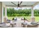 Spacious backyard patio with a fire pit and ample seating at 1484 Old Rosebud Trl, Awendaw, SC 29429