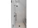 Bright white tiled shower with marble bench and modern fixtures at 1484 Old Rosebud Trl, Awendaw, SC 29429