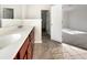 Bathroom with double vanity and wood cabinets at 158 Mayfield Dr, Goose Creek, SC 29445
