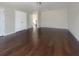 Large bedroom with dark hardwood floors and double doors at 158 Mayfield Dr, Goose Creek, SC 29445