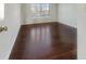 Spacious bedroom with hardwood floors and large window at 158 Mayfield Dr, Goose Creek, SC 29445