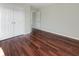 Well-lit bedroom with hardwood floors and double doors at 158 Mayfield Dr, Goose Creek, SC 29445