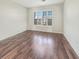 Well-lit bedroom with hardwood floors and window with shutters at 158 Mayfield Dr, Goose Creek, SC 29445