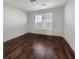 Bright bedroom with hardwood floors and window with shutters at 158 Mayfield Dr, Goose Creek, SC 29445