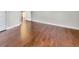 Bright bedroom featuring hardwood floors and access to hallway at 158 Mayfield Dr, Goose Creek, SC 29445