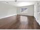 Spacious bedroom with dark hardwood floors and large window at 158 Mayfield Dr, Goose Creek, SC 29445