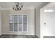 Bright dining room with chandelier and plantation shutters at 158 Mayfield Dr, Goose Creek, SC 29445