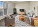 Cozy living room with gray sectional and wood accents at 158 Mayfield Dr, Goose Creek, SC 29445